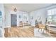 Well-lit living room combining an office area, stylish decor, and hardwood floors for a versatile, inviting space at 418 Magna Dr, Durham, NC 27703