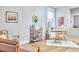 Bright living area with modern decor, including a book shelf, desk, and light-colored wood flooring at 418 Magna Dr, Durham, NC 27703