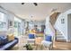 Open-concept living room with bright kitchen, stairs, and comfortable seating at 418 Magna Dr, Durham, NC 27703