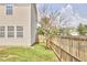 Green side yard featuring a privacy fence at 418 Magna Dr, Durham, NC 27703