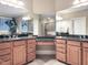 Elegant bathroom with double vanities, granite counters, and a glass-enclosed shower at 4416 Brighton Ridge Dr, Apex, NC 27539