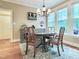Elegant dining room featuring a round table, chandelier, and a buffet with a wine rack at 4416 Brighton Ridge Dr, Apex, NC 27539