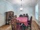 Elegant dining room with traditional furniture, chandelier, and wainscoting at 4416 Brighton Ridge Dr, Apex, NC 27539