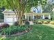 Charming two-story home featuring a welcoming front porch and a well-manicured lawn with mature landscaping at 4416 Brighton Ridge Dr, Apex, NC 27539