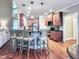 Modern kitchen featuring a breakfast bar, stainless steel appliances, and wooden cabinets at 4416 Brighton Ridge Dr, Apex, NC 27539