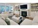 Bright living room featuring a fireplace, built-in bookshelves, and comfortable seating at 4416 Brighton Ridge Dr, Apex, NC 27539