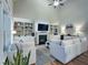 Spacious living room with vaulted ceiling, fireplace, and built-in shelving at 4416 Brighton Ridge Dr, Apex, NC 27539