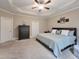 Comfortable main bedroom featuring soft carpet and stylish tray ceiling at 4416 Brighton Ridge Dr, Apex, NC 27539
