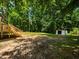 This backyard features a small storage shed and plenty of green space at 4428 W West River Rd, Franklinton, NC 27525