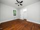 Bedroom with hardwood floors, ceiling fan, and a closet for ample storage at 4428 W West River Rd, Franklinton, NC 27525