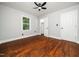 Bright bedroom featuring a closet and hardwood flooring throughout at 4428 W West River Rd, Franklinton, NC 27525