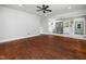 Open living space flows into a modern kitchen with stainless steel appliances and a large refrigerator at 4428 W West River Rd, Franklinton, NC 27525