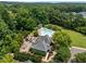 An aerial view showing a swimming pool, playground, and community buildings at 444 Claremont Dr, Chapel Hill, NC 27516