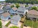 An aerial view of a neighborhood with fenced yards and detached garages at 444 Claremont Dr, Chapel Hill, NC 27516