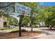Community basketball hoop ready for a game on a sunny day in a Gathering friendly neighborhood at 444 Claremont Dr, Chapel Hill, NC 27516