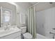 Well-lit bathroom with white vanity, toilet, and tub-shower combination at 444 Claremont Dr, Chapel Hill, NC 27516