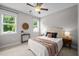 Cozy bedroom with two windows, decorative lighting, and comfortable furnishings at 444 Claremont Dr, Chapel Hill, NC 27516