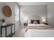 Serene bedroom boasts a comfortable bed, two side tables, and natural light from a window at 444 Claremont Dr, Chapel Hill, NC 27516