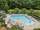 Community pool featuring various seating options, shaded areas, and a fun fountain feature at 444 Claremont Dr, Chapel Hill, NC 27516