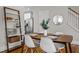 Bright dining area with modern chairs, a wooden table, and open access to the kitchen at 444 Claremont Dr, Chapel Hill, NC 27516