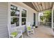 Relaxing front porch with rocking chairs, a welcoming entrance, and views of the neighborhood at 444 Claremont Dr, Chapel Hill, NC 27516