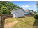 Detached garage in a backyard with a wooden fence for added security and privacy at 444 Claremont Dr, Chapel Hill, NC 27516