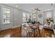 Open-concept room features hardwood flooring, decorative ceiling fan, and comfortable seating area at 444 Claremont Dr, Chapel Hill, NC 27516