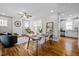 Spacious living room and dining area with hardwood floors and an abundance of natural light at 444 Claremont Dr, Chapel Hill, NC 27516