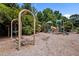 Community playground with swings, slides, and climbing structures amid lush greenery at 444 Claremont Dr, Chapel Hill, NC 27516
