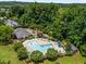 An aerial view of the community pool with lounge chairs and a splash pad at 444 Claremont Dr, Chapel Hill, NC 27516