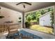 Relaxing covered porch with outdoor seating and backyard view at 444 Claremont Dr, Chapel Hill, NC 27516