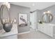 Elegant bathroom with dual vanities, decorative mirrors, and modern fixtures at 45 Shady Creek Way, Fuquay Varina, NC 27526