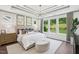 Spacious bedroom features large windows, tray ceilings, and plush carpeting at 45 Shady Creek Way, Fuquay Varina, NC 27526