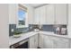 Charming butler's pantry with stylish backsplash, white countertops, and ample cabinet space at 45 Shady Creek Way, Fuquay Varina, NC 27526