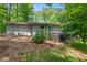 A charming single story home with a side entry garage and stone patio at 4501 Zebulon Rd, Zebulon, NC 27597