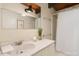 Bathroom featuring a marble vanity top and shower with white tile and shower curtain at 4501 Zebulon Rd, Zebulon, NC 27597