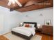 Clean bedroom with hardwood floors, modern furnishings, and wood ceiling at 4501 Zebulon Rd, Zebulon, NC 27597
