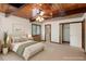 Bedroom featuring wood ceilings, neutral paint, ceiling fan and closet at 4501 Zebulon Rd, Zebulon, NC 27597
