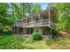Expansive back deck with ground level patio of this light gray exterior home at 4501 Zebulon Rd, Zebulon, NC 27597