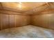 Bare interior features panelled walls and a pale concrete floor at 4501 Zebulon Rd, Zebulon, NC 27597