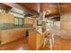 Well-lit kitchen with an island bar, sleek countertops, and modern appliances, perfect for cooking at 4501 Zebulon Rd, Zebulon, NC 27597