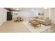 Open basement layout with dining table, couch, and recessed lighting throughout at 4501 Zebulon Rd, Zebulon, NC 27597