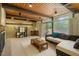 Bright and inviting living area with comfortable seating, stone accent wall, and a cozy atmosphere at 4501 Zebulon Rd, Zebulon, NC 27597