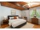 Serene main bedroom with ample natural light, wooden floors, and a minimalist aesthetic at 4501 Zebulon Rd, Zebulon, NC 27597
