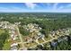 Scenic aerial view of a sprawling residential neighborhood with mature trees and well-spaced homes at 456 Majestic Oak Dr, Garner, NC 27529
