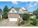 Inviting home featuring a brick facade, a two-car garage, and a landscaped front yard at 456 Majestic Oak Dr, Garner, NC 27529
