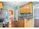 Well-lit kitchen featuring granite countertops, wood floors, and stainless steel appliances at 456 Majestic Oak Dr, Garner, NC 27529