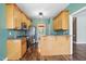 Well-lit kitchen featuring wood cabinets, granite countertops, and stainless steel appliances at 456 Majestic Oak Dr, Garner, NC 27529