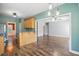 Open concept kitchen with breakfast bar seamlessly connected to the dining and living spaces at 456 Majestic Oak Dr, Garner, NC 27529