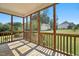 This sunroom has wood floors and screens all around at 456 Majestic Oak Dr, Garner, NC 27529
